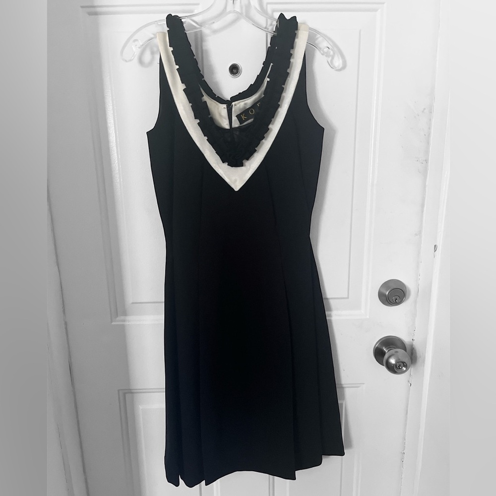 Basic little black dress. KOEL size 4. Polyester dry clean. Falls below knee